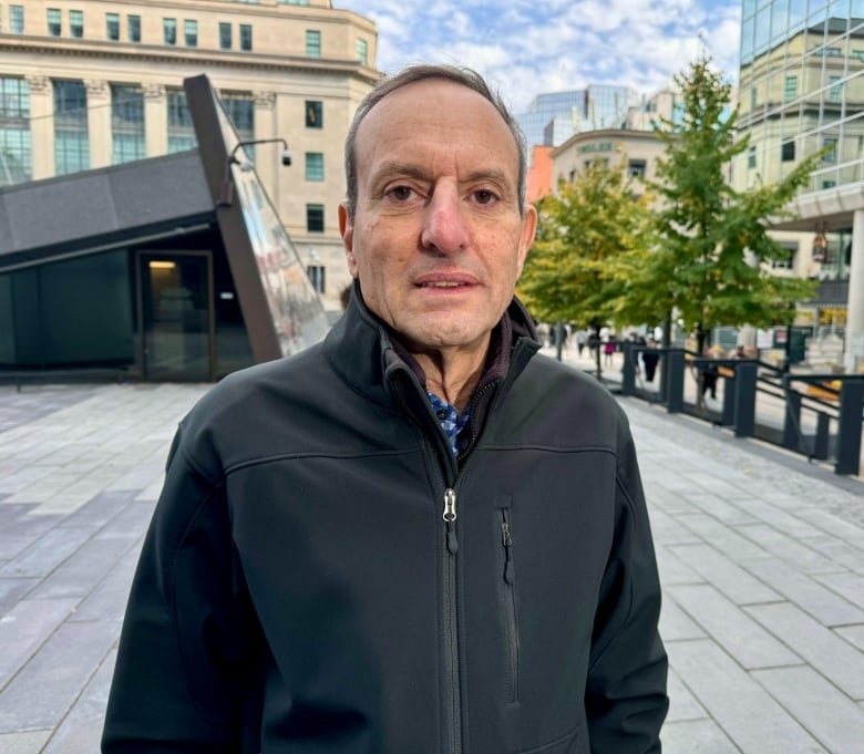 A man stands outside.