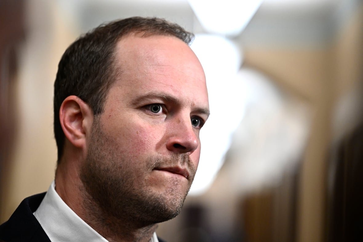 Liberal MP Nathaniel Erskine-Smith takes questions from reporters as he arrives for a meeting of the Liberal caucus, on Parliament Hill in Ottawa, on Wednesday, June 5, 2024.