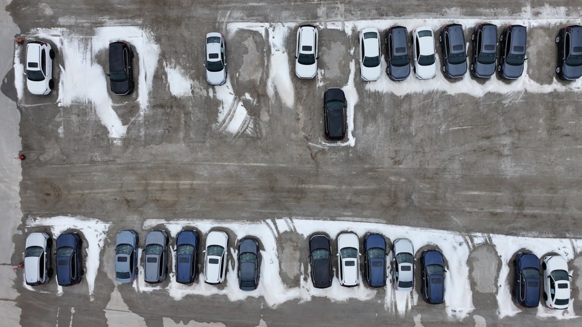 Parked cars are shown from overhead.