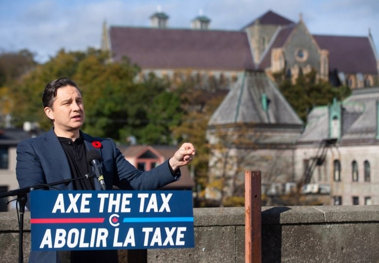 Conservative Leader Pierre Poilievre holds a press conference regarding his “Axe the Tax” message from the roof a parking garage in St. John’s in 2023.