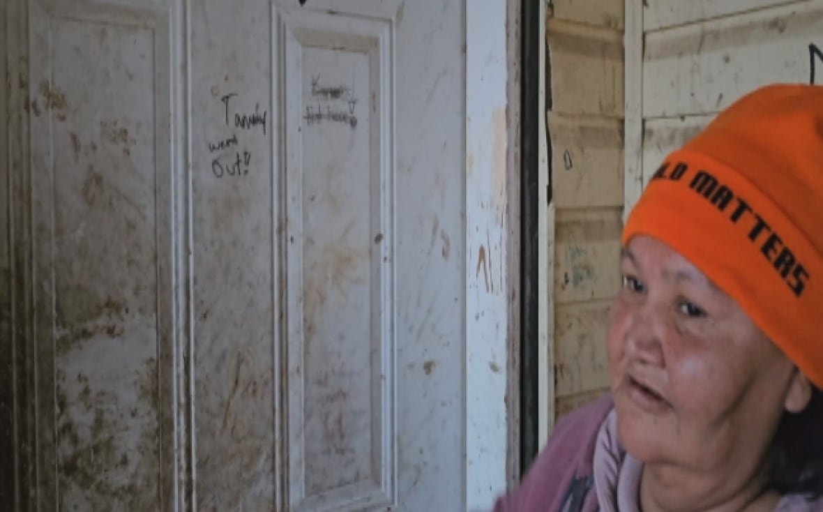 "Tammy went out" is still scrawled on Lena Harper's front door in Wasagamack First Nation. The grandmother says she still watches the road in hopes of seeing Tammy returning to her home.