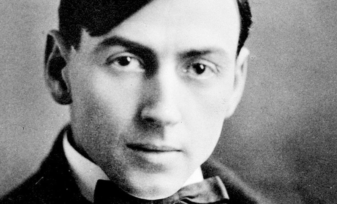 A black and white portrait of Tom Thomson.