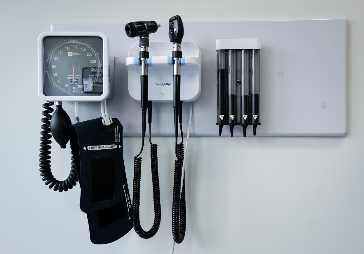Medical tools hang from the wall of a doctor's office.