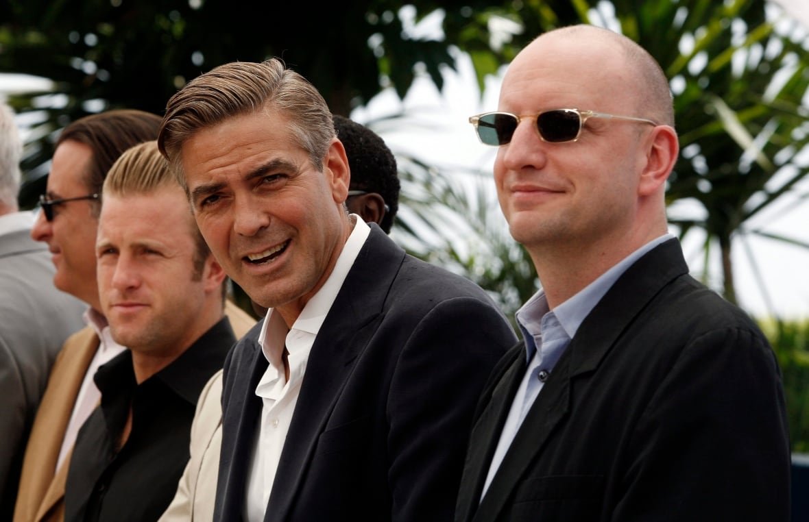 American actor Scott Caan, left, American actor George Clooney, center, and American director Steven Soderbergh pose during a photo call for the film "Ocean's Thirteen," at the 60th International film festival in Cannes, southern France, on Thursday, May 24, 2007. (AP Photo/Jeff Christensen)
