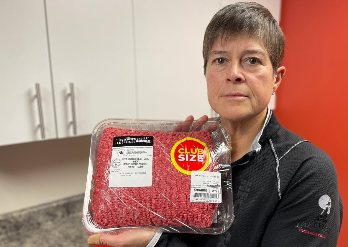 Iris Griffin holding a package of ground beef. 