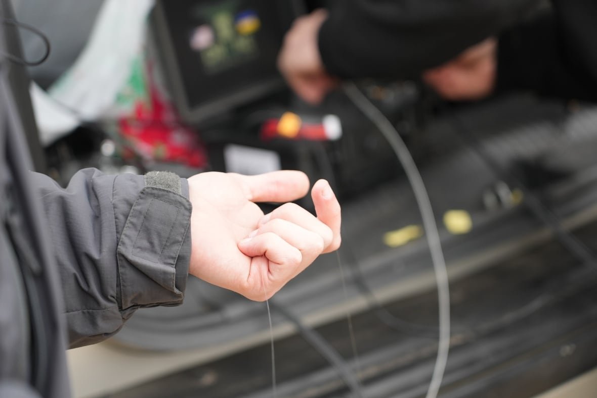 The barely visible fibre-optic cable is attached to the drone and coiled in a spool and then unravels during flight. 