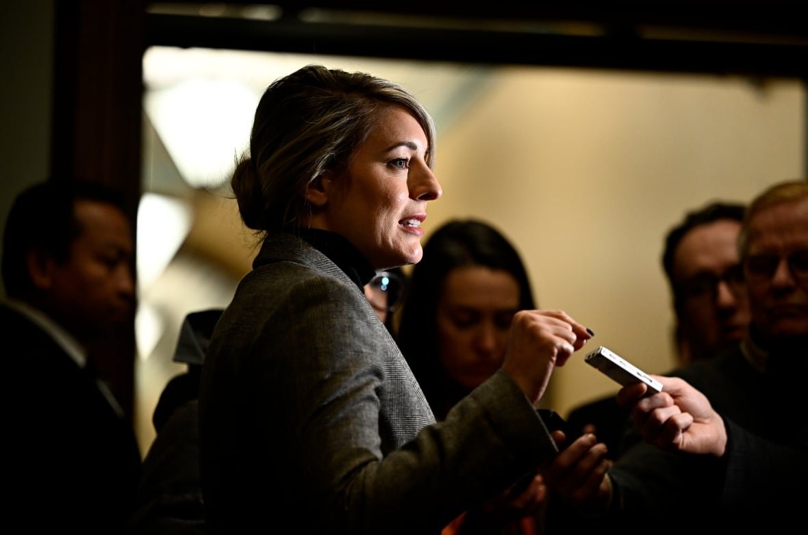 Minister of Foreign Affairs Melanie Joly answers questions from journalists before a meeting of the Liberal caucus in West Block on Parliament Hill in Ottawa, on Thursday, Jan. 23, 2025.