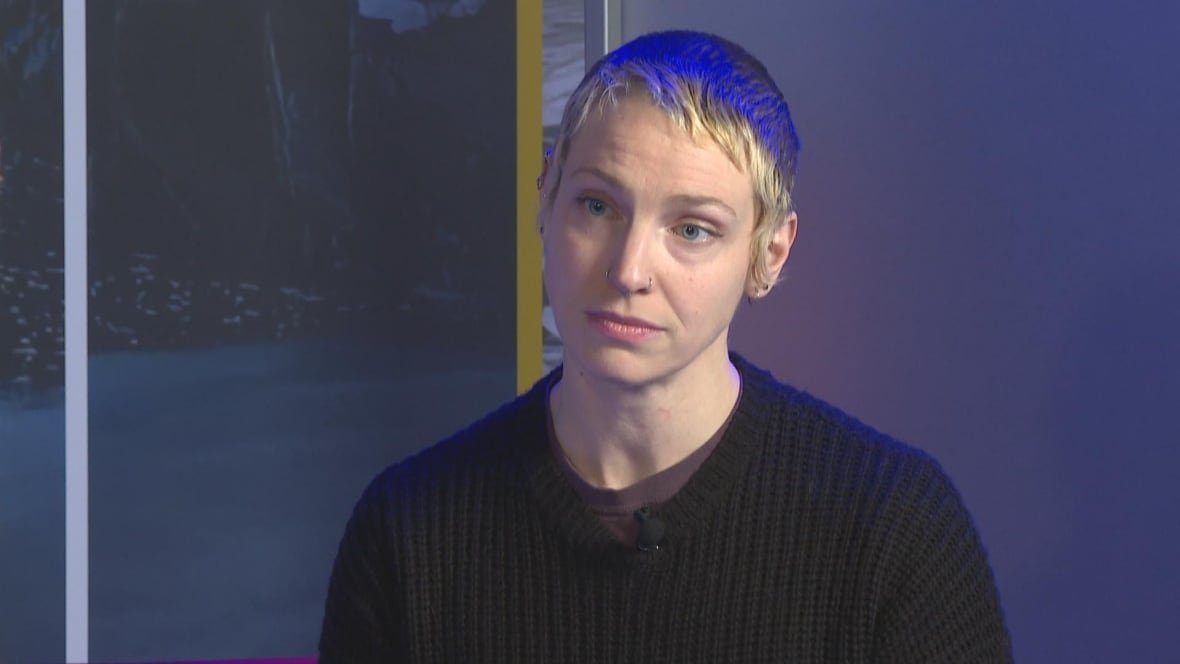 A person with short blonde hair.
