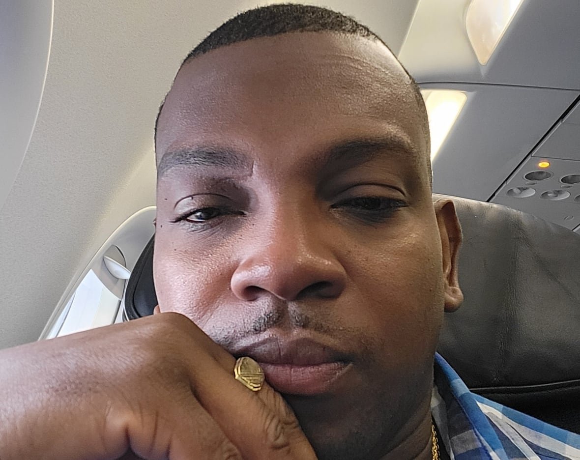 Selfie of man seated on plane. 