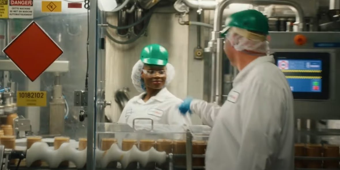 Workers at a Kraft facility are shown in a new advertisement highlighting the company's Canadian connections that debuted during the Super Bowl.