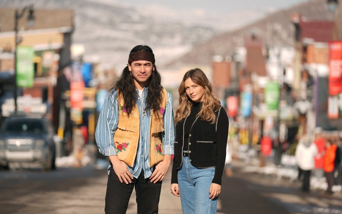 Julian Brave NoiseCat, left, and Emily Kassie, co-directors of the Oscar-nominated documentary film "Sugarcane," pose for a portrait on Main Street during the Sundance Film Festival.
