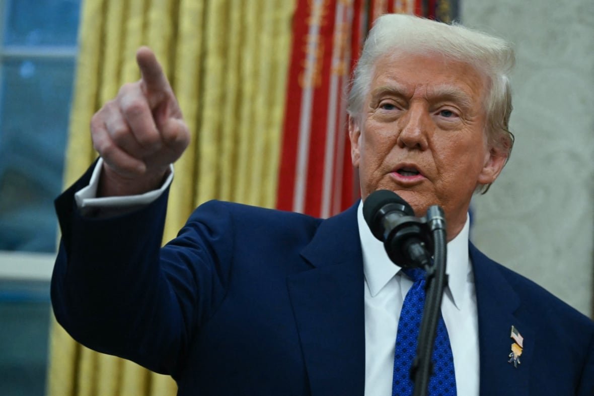 U.S. President Donald Trump is seen pointing, while speaking in the Oval Office.