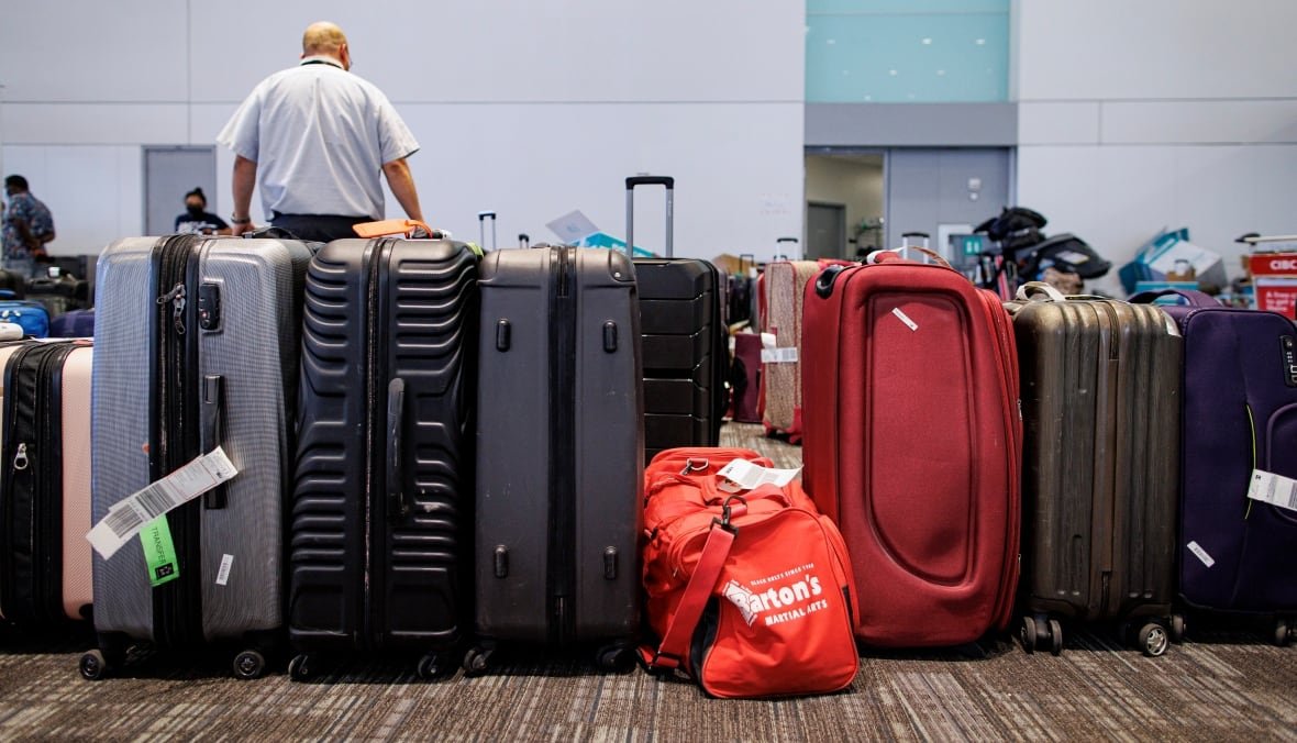 A row of unclaimed luggage at the airport