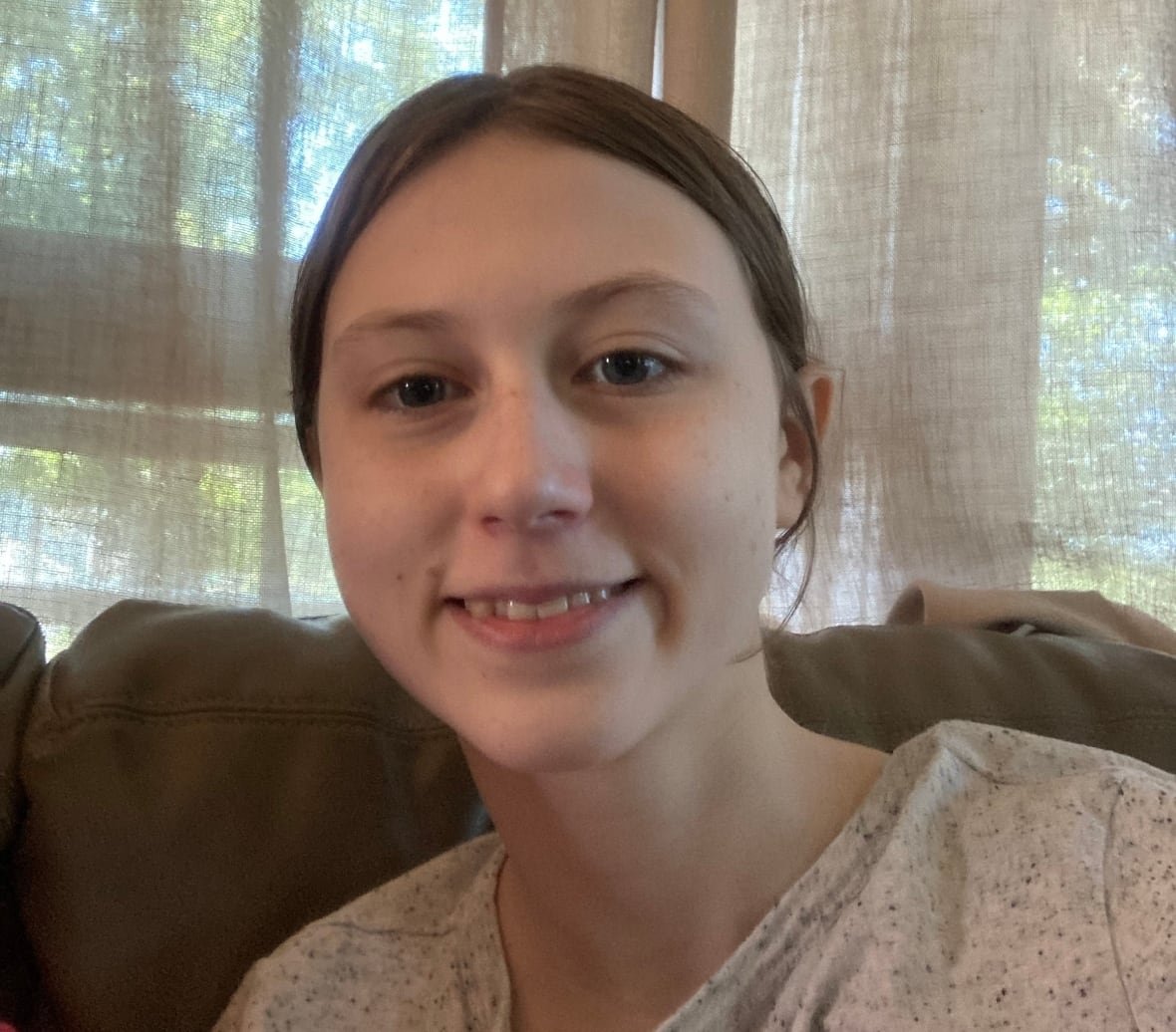 young girl smiles for the camera