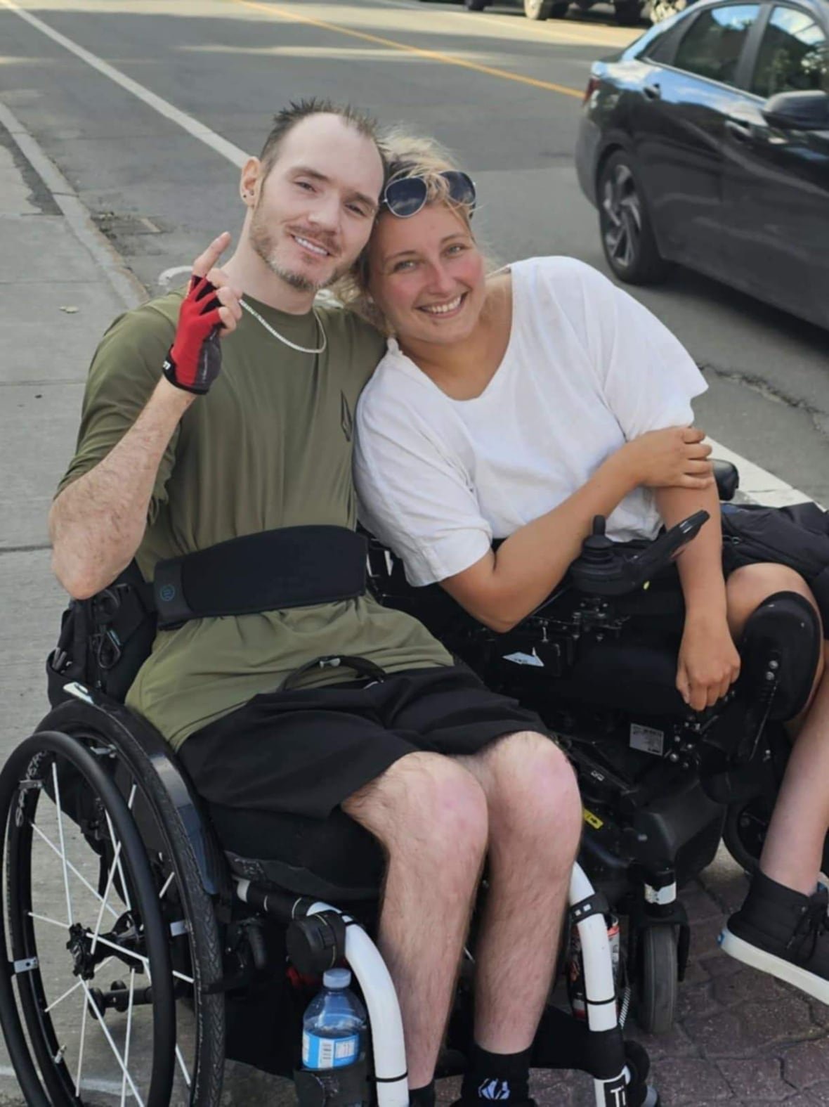 A man in a wheelchair pictured with a woman. 