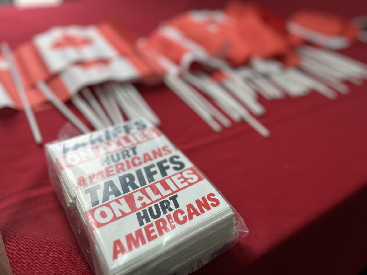 A sticker with red and black text reading 'tariffs on allies hurt Americans'