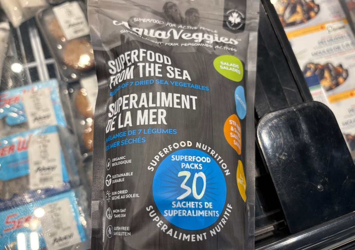 A package of dried seaweed called Aqua Veggies, Superfood from the Sea, sits on a freezer in a grocery store.