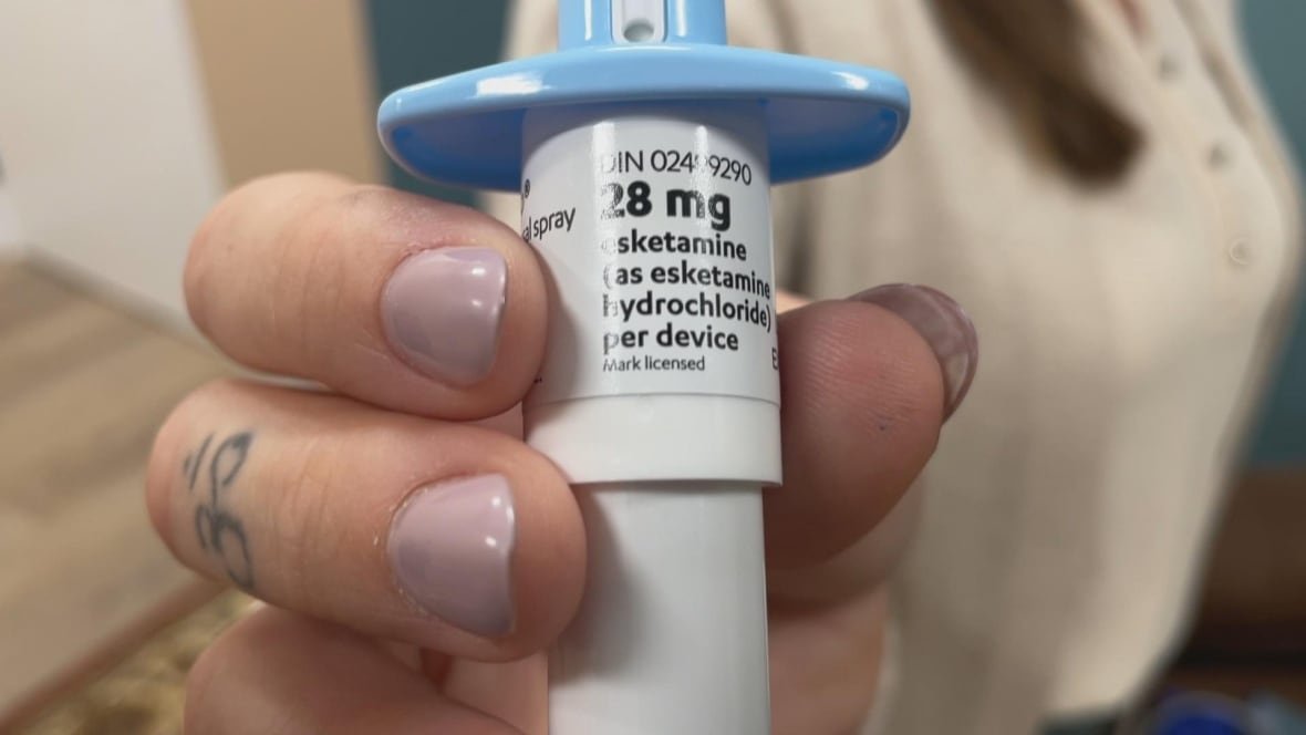 A close-up of a ketamine nasal spray device.