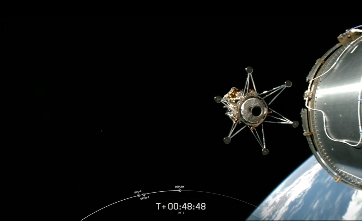 A photo from above earth is shown with part of what appears to be a spaceship.
