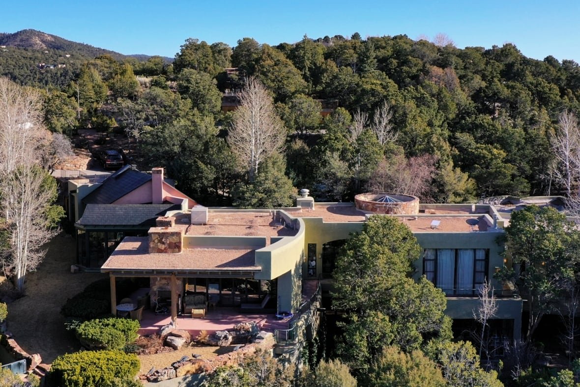 A large house surrounded by trees.