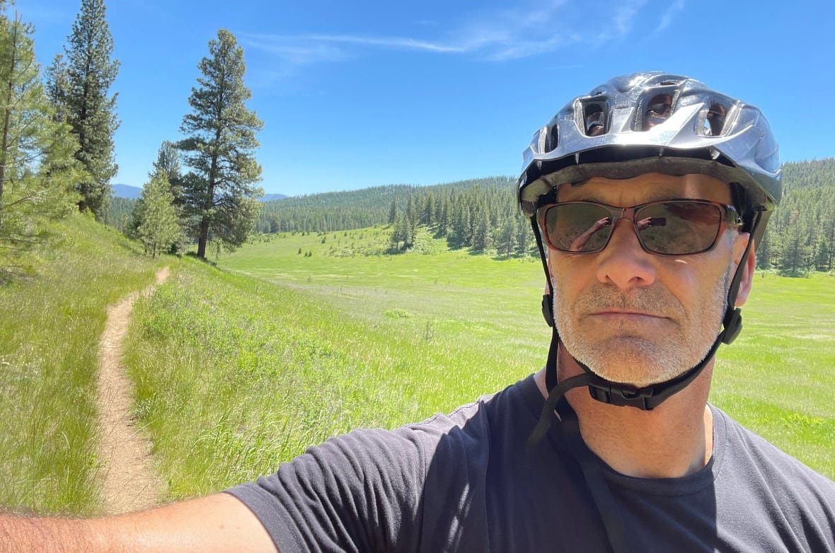 A selfie of a man in a bike helmet