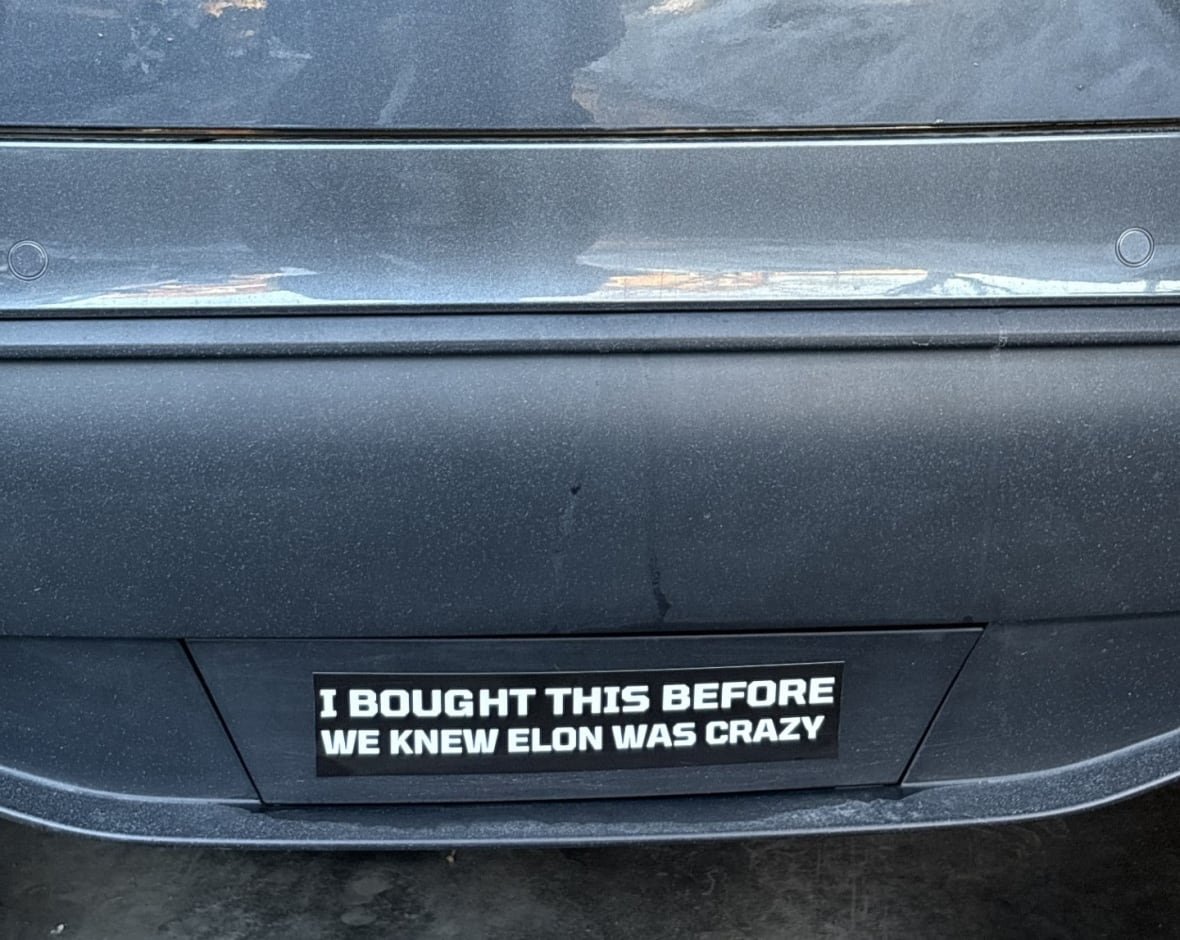 Tesla bumper sticker that reads, "I bought this before we knew Elon was crazy."