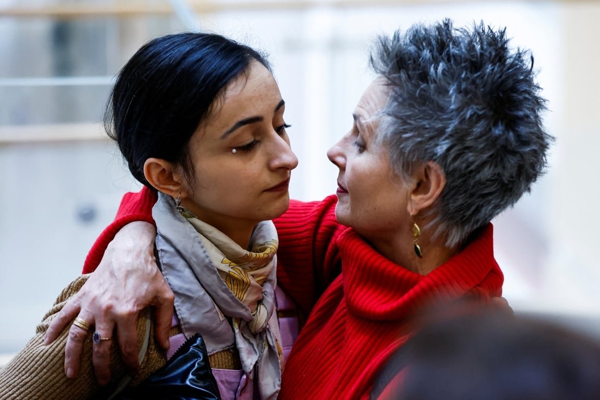 Actor Charlotte Arnould hugs Anouk Grinberg, on the day of the trial of French actor Gérard Depardieu for two sexual assaults allegedly committed on the set of the film "Les Volets Verts", at the courthouse in Paris, France, March 24, 2025.
