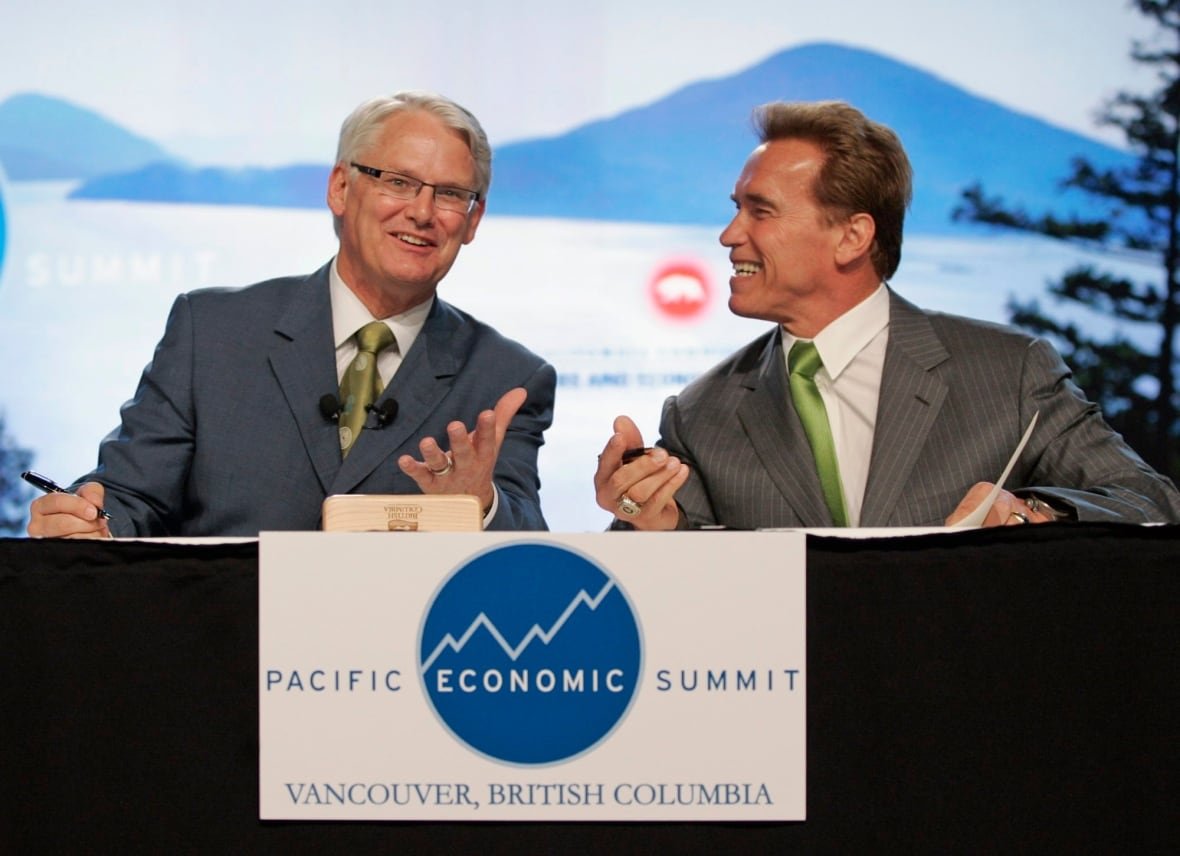 Two men, one Arnold Schwarzenegger, at the Pacific Economic Summit in Vancouver.