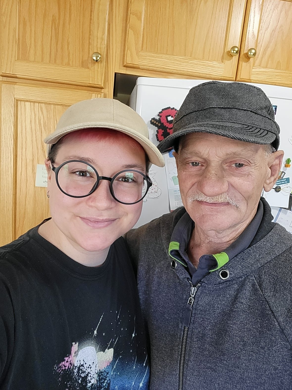 Woman smiles in a photo of her and her father.