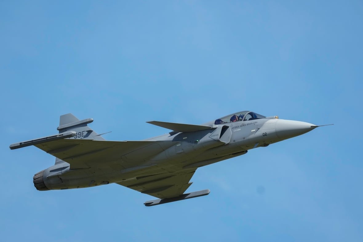 A jet is seen flying in the air.