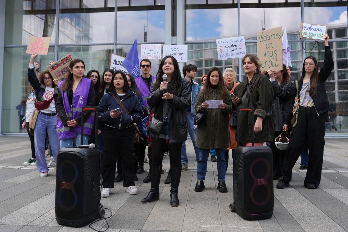 Women demonstrate outside the palace of justice where actor Gérard Depardieu faces trial for the alleged sexual assaults of two women on a film set in 2021, Monday, March 24, 2025 in Paris. 