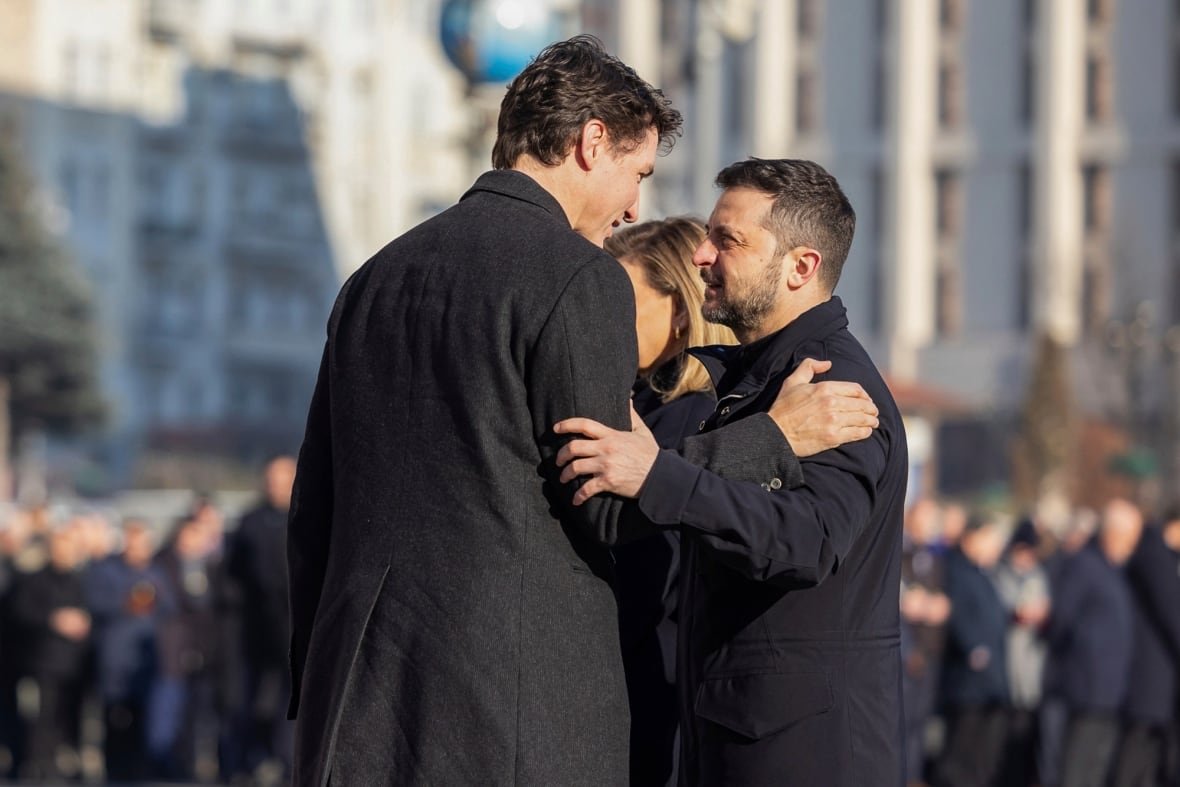 In this photo provided by the Ukrainian Presidential Press Office, Office shows Ukraine's President Volodymyr Zelensky, right, greeting Canada's Prime Minister Justin Trudeau during a ceremony in Kyiv, Ukraine, Monday, Feb. 24, 2025.