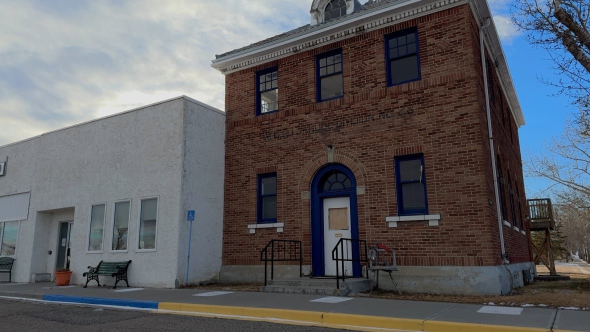 A two story brick building is shown in Granum, Alta. It is the former town office. 