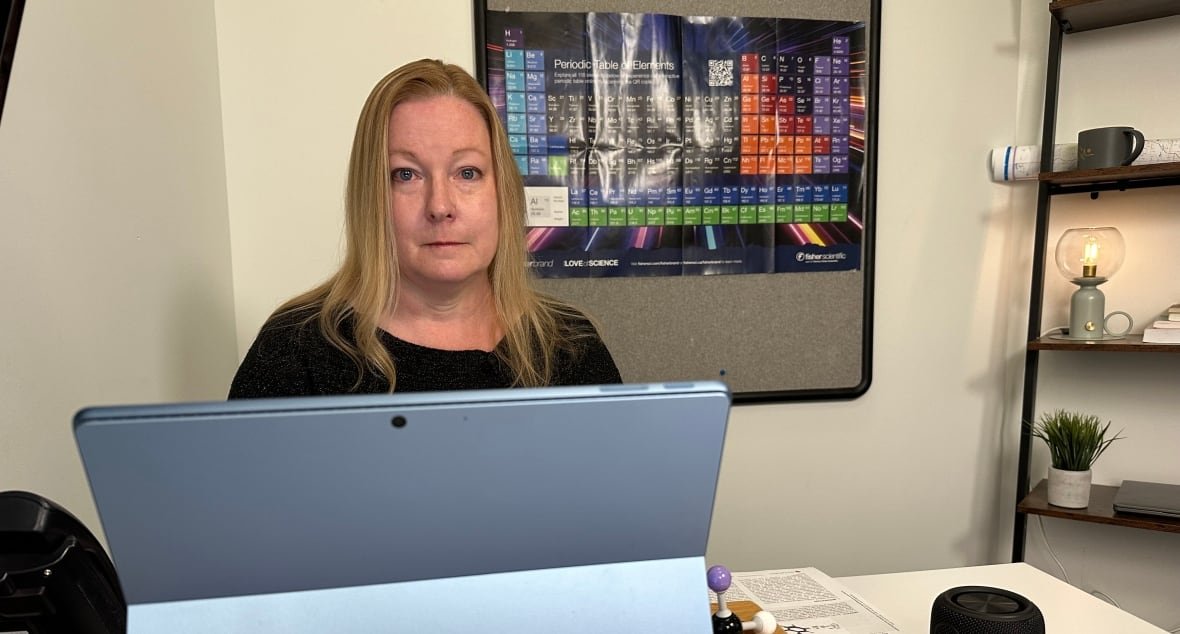 Jennifer Love sitting behind her computer