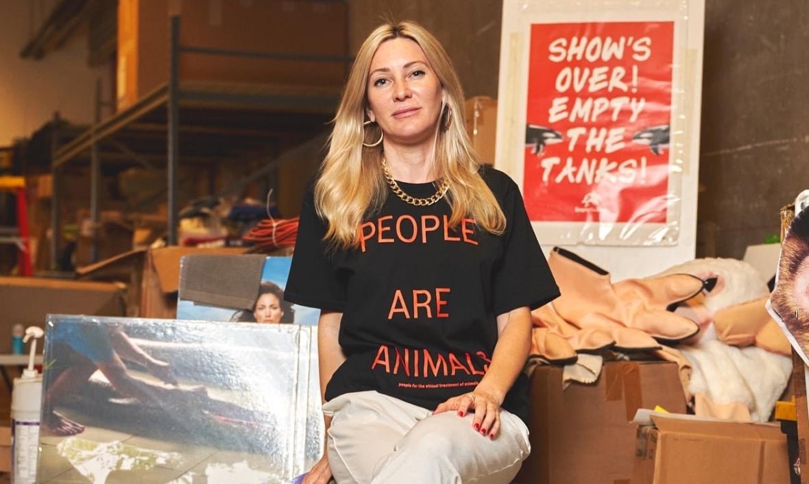 A woman wears a t-shirt that says People Are Animals.