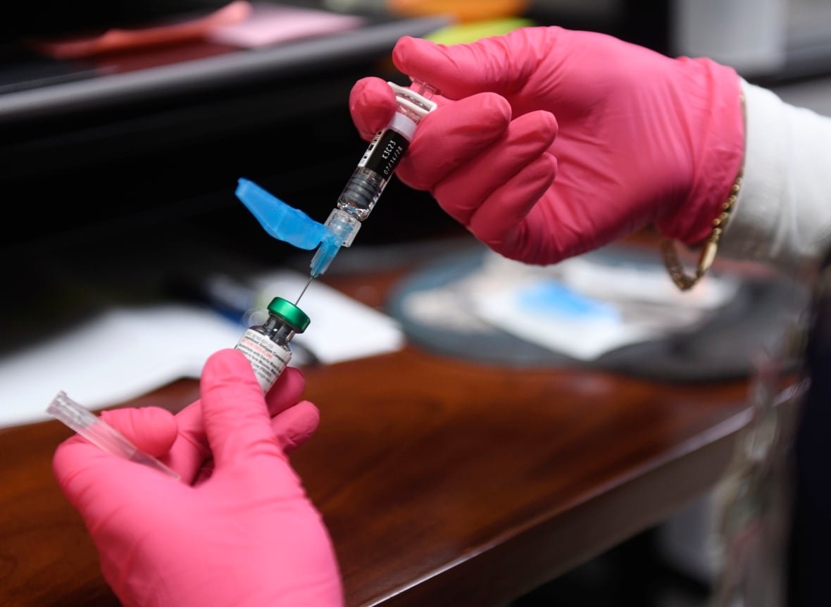 A measles, mumps and rubella vaccine is prepared. 