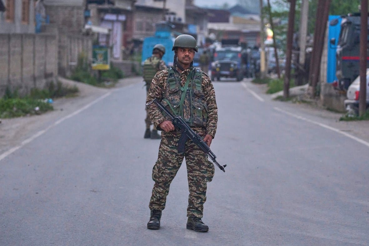 Indian paramilitary soldiers stand guard in the Pulwana district of Indian-controlled Kashmir.