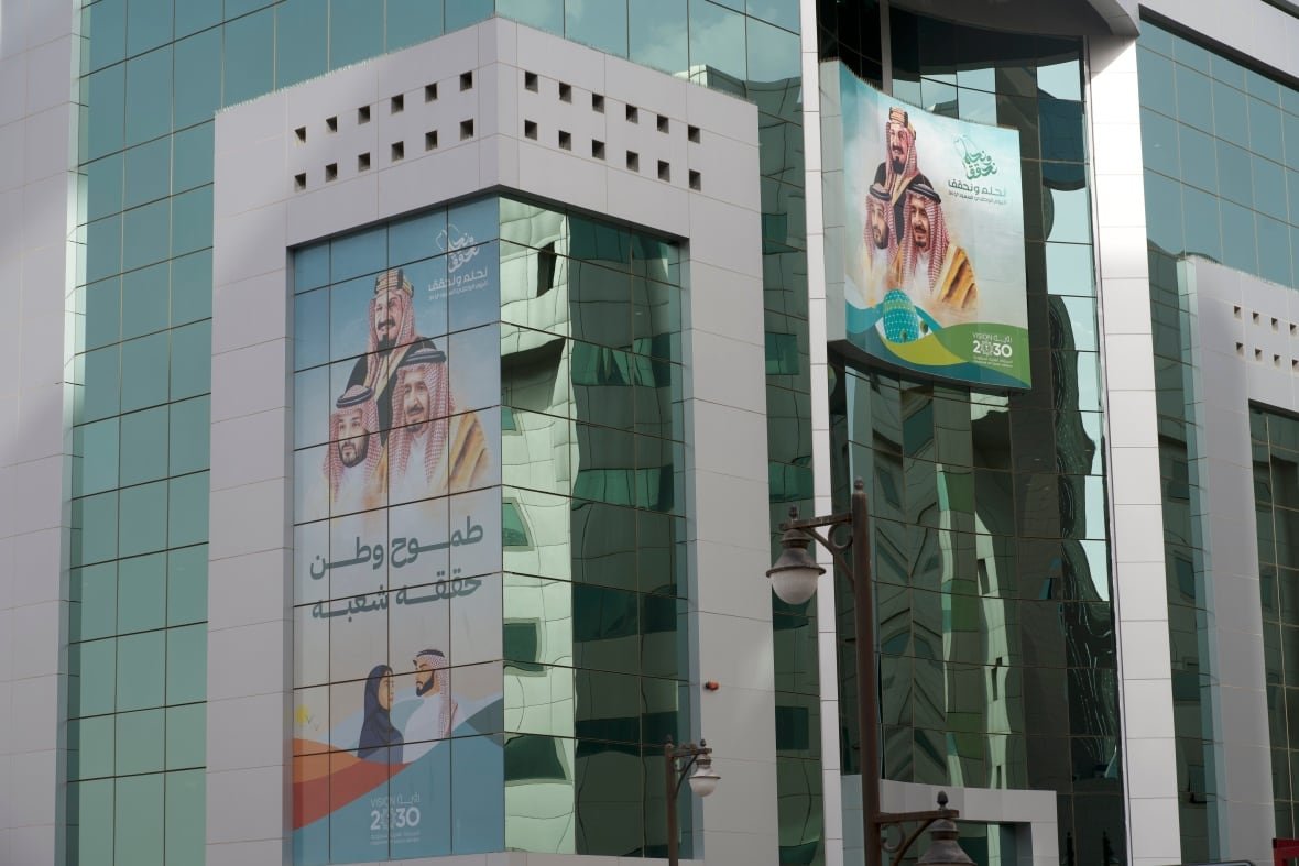 The faces of key members of Saudi's Royal family are embedded on Riyadh skyscrapers, championing the Vision 2030 project and the transformation of the country's economy.