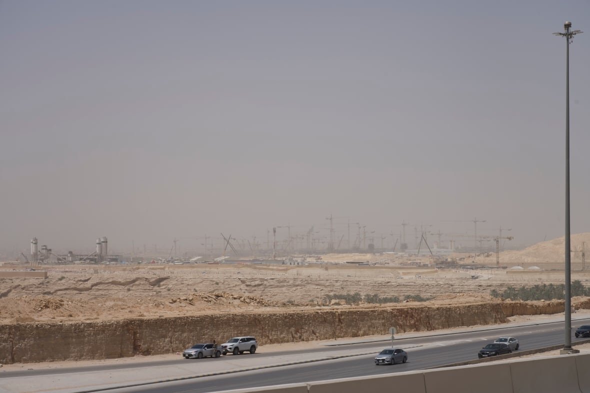Construction cranes fill the desert horizon outside the capital Riyadh. The country is in the midst of an immense building boom as part of its Vision 2030.