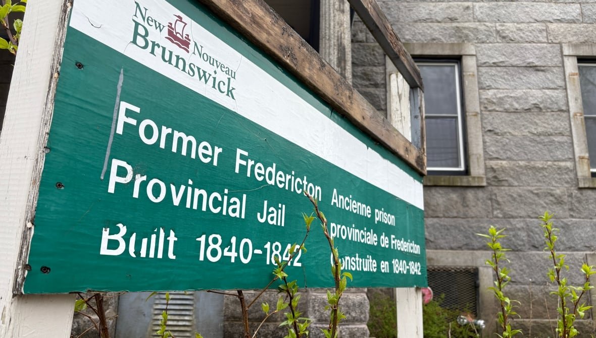A sign posted in front of the former York County jail in Fredericton.