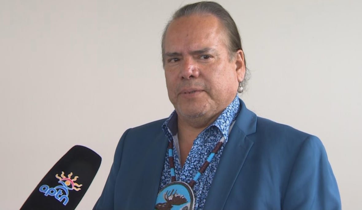 A man speaks into a microphone.