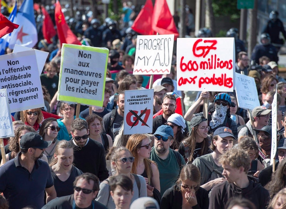 Demonstrators march in Quebec City as they protest the annual summit of G7 leaders on Saturday, June 9, 2018. 