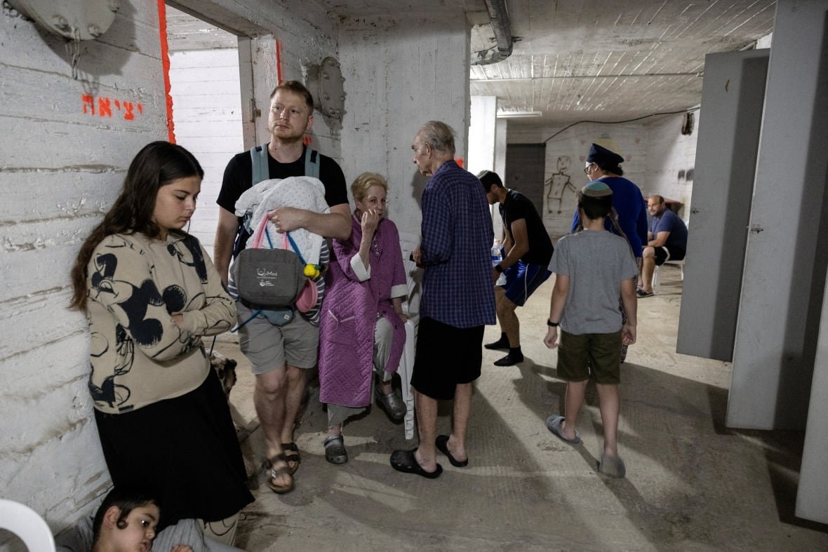 Israelis gather in a shelter following sirens in Tel Aviv, Israel.