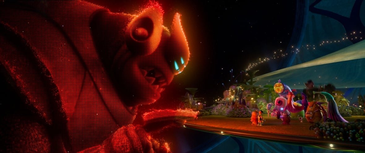 An animated image is shown. In it, a hologram of a giant, red alien is shown. He is threateningly leaning over a platform, on which other aliens are standing.