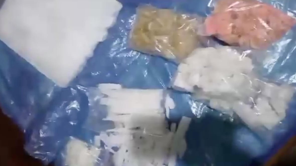 A tarp with various powders and substances on it.