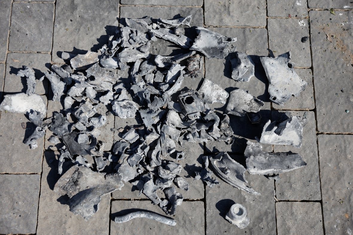 Fragments of a grey coloured metal are shown on the ground