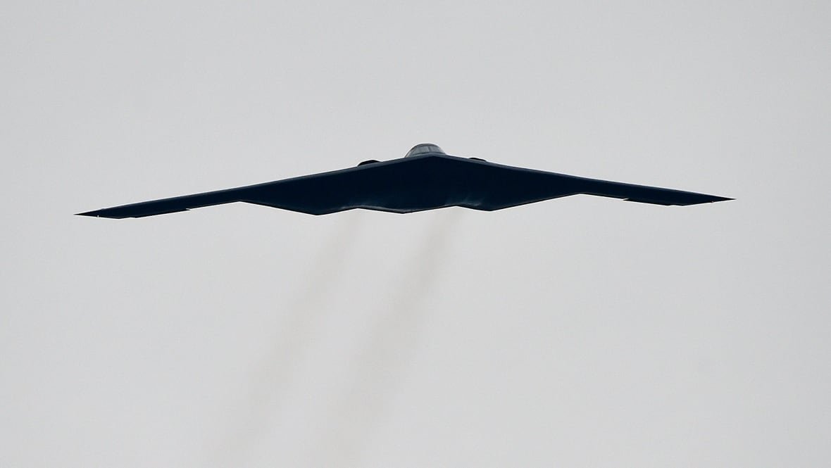 A stealth bomber is seen flying in the sky.