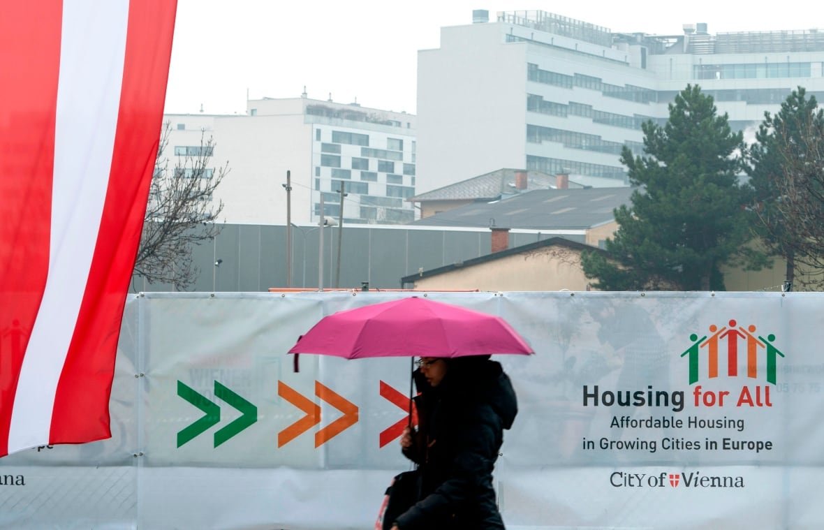 A composite photo shows the exterior of the same three-storey apartment building before and after renovations.
