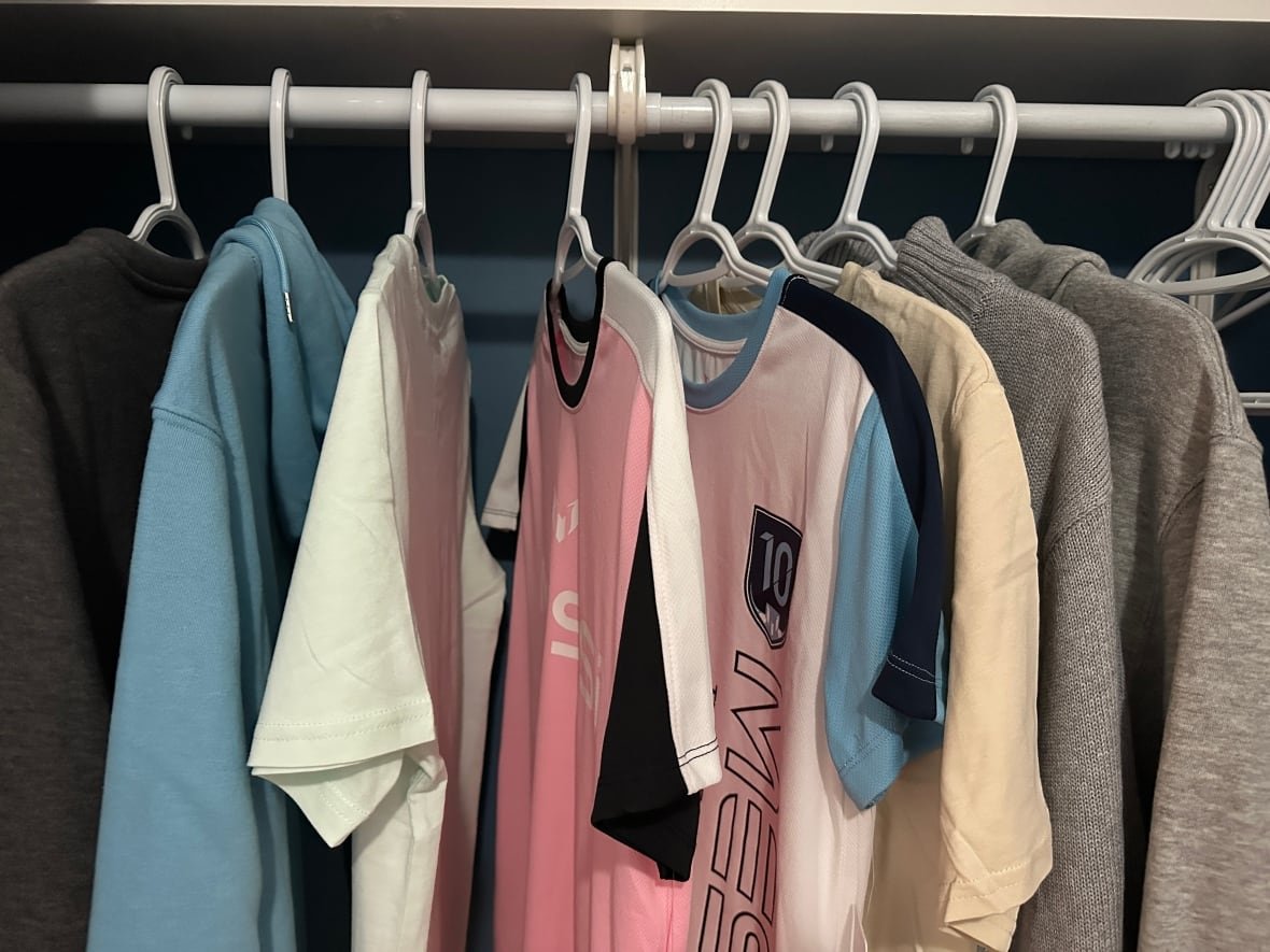 boys clothing in closet. 