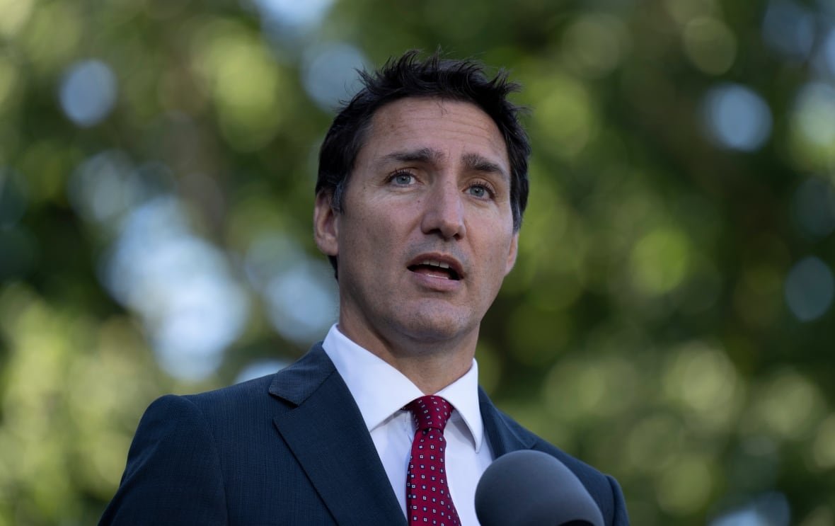 Medium close-up of a man in a suit.